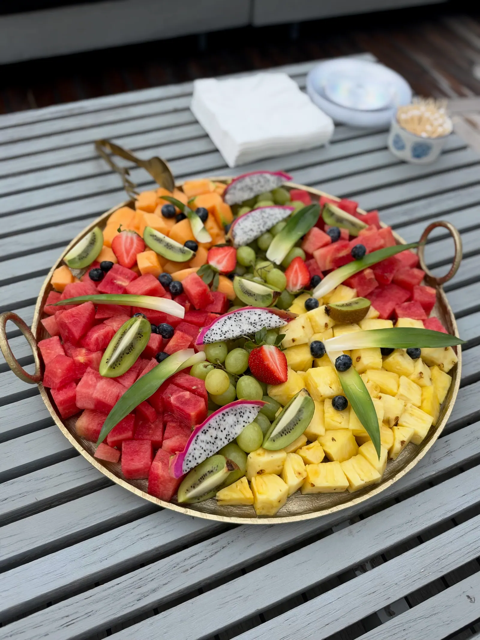 Colorful platter of fresh fruit with watermelon, pineapple, grapes, and berries