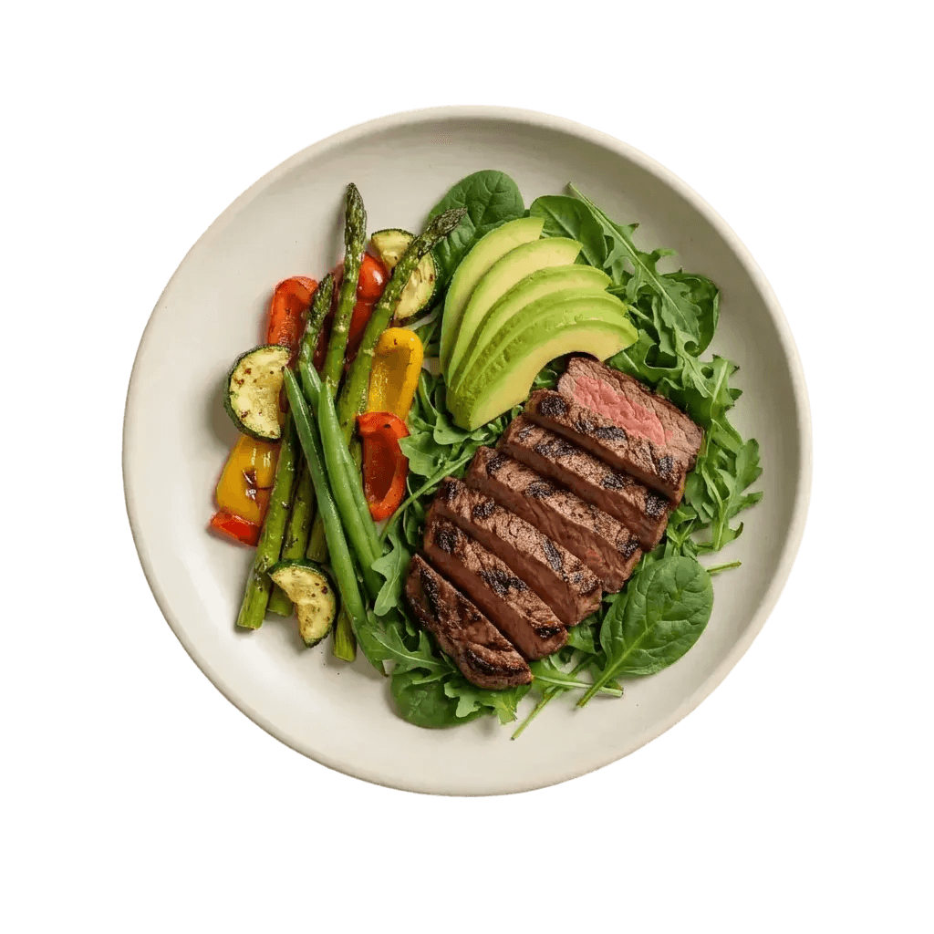 A Tati prepared steak meal with vegetables and avocado
